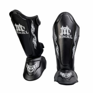Protège-tibias Mongkol SGM02 en cuir véritable, conçus pour le Muay Thaï, le kick-boxing et le MMA. Ultra légers, résistants et confortables, ils offrent une protection optimale et une grande liberté de mouvement. Idéal pour les combattants exigeants à la recherche d’un équipement durable et performant.