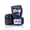 Gants de boxe Fairtex bgv1 bleu Gants de boxe Fairtex BGV1 bleu Muay Thai premium fabriqués en Thaïlande avec protection haute densité pour entraînement boxe kickboxing et sports de combat