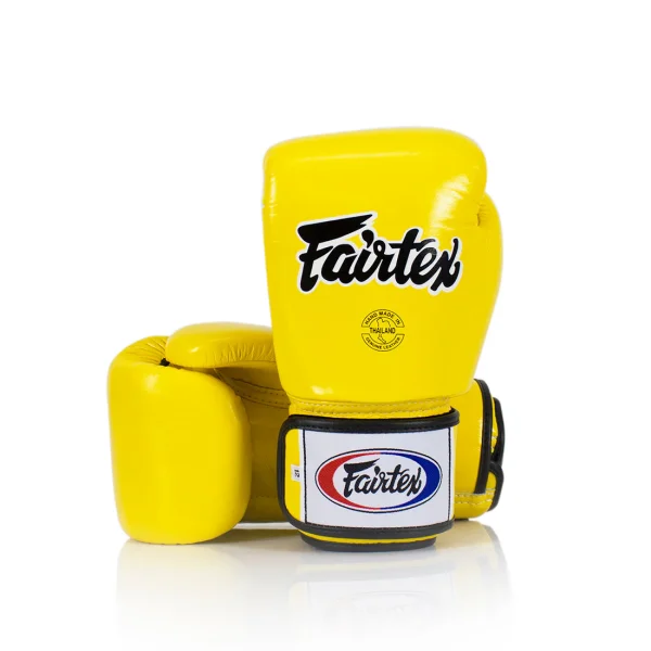 Gants de boxe Fairtex bgv1 jaune Gants de boxe Fairtex BGV1 jaune Muay Thai premium fabriqués en Thaïlande avec protection haute densité pour entraînement boxe kickboxing et sports de combat